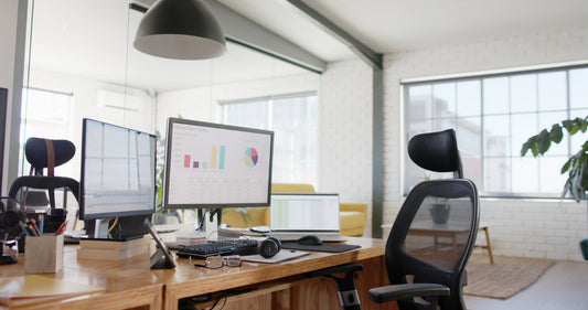 Multi-functional office furniture with computer monitors and an ergonomic chair 