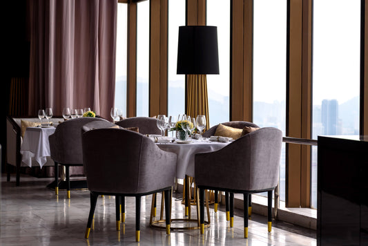 Elegant chairs and tables in a stylish restaurant setting.
