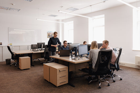 Colleagues having a meeting in an office with modern office furniture