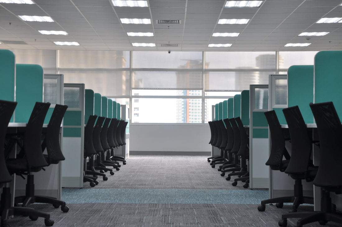 Empty black sohum office chairs at cubicles