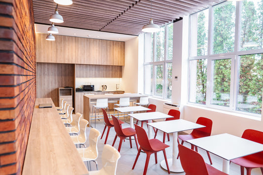 A modern and scenic eating area with canteen chairs, tables, and appliances