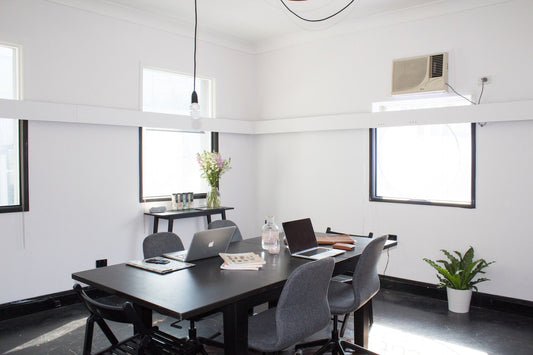 Minimalist office furniture in a minimalist space allows for a variety of uses